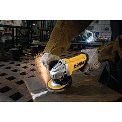 Small angle grinder being used to grind metal.
