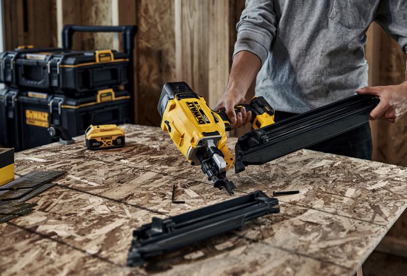 DEWALT nailer DZN930-XJ, DZN930 in use on plywood, toolboxes and battery also shown.